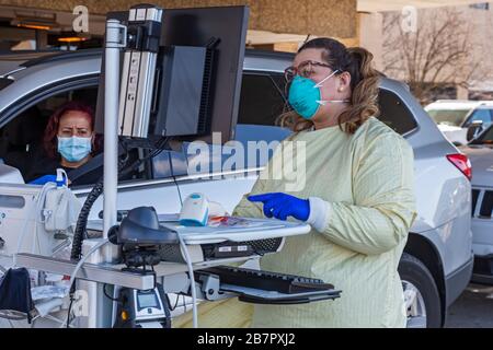 Royal Oak, Michigan, USA. 17th Mar, 2020. Drive-though testing for the Covid-19 virus outside Beaumont Hospital. Credit: Jim West/Alamy Live News Stock Photo