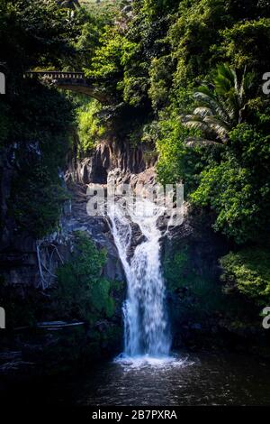 Waterfall pours below bridge at Oheo Gulch in Haleakala National Park on Maui, Hawaii. Stock Photo