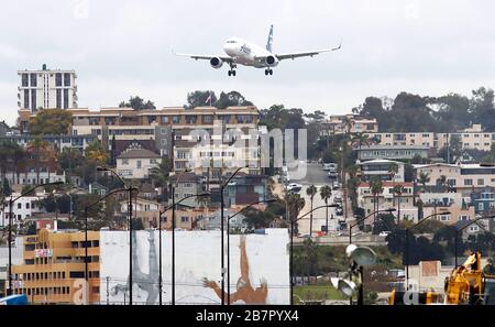 San Diego, CA, USA. 16th Mar, 2020. An Alaska Air jetliner come in on final approach for a landing at Lindbergh Field in San Diego. US airlines are seeking more than $50 billion in bailout money to cover their expenses as they deal with the reduced passenger demand in light of the COVID-19 pandemic. John Gastaldo photo Credit: John Gastaldo/ZUMA Wire/Alamy Live News Stock Photo