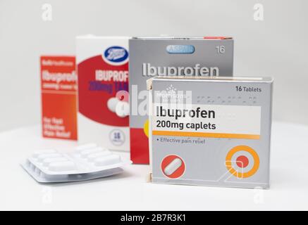 London / UK - March 17th 2020 - Supermarket brands of Ibuprofen anti-inflammatory medication boxes and packs of tablets on a white background. Stock Photo