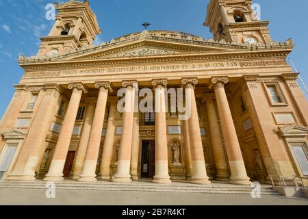 The front facade and entrance to the Mosta Rotunda or Basilica of the Assumption of Our Lady in Mosta, Malta. Stock Photo