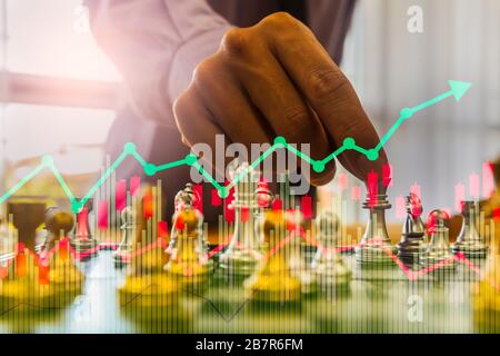 Chess game on chess board on stock market or forex trading graph chart for financial investment concept. Economy trends for digital business marketing Stock Photo