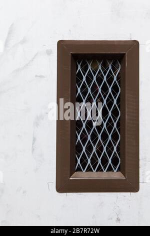 Small Security Window in Door Stock Photo