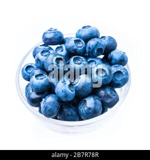 Blue berries in a glass cup, isolated on white Stock Photo
