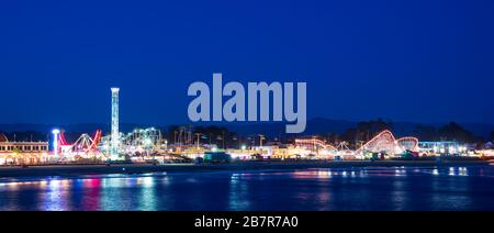 Panoramic view of amusement park on Santa Cruz beach at night, California, USA Stock Photo