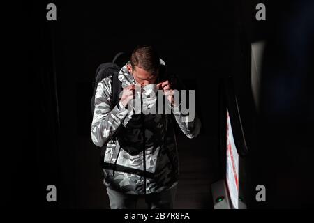 Bucharest, Romania. 17th Mar, 2020. A man wears a face mask at Henri Coanda International Airport in Bucharest, Romania, March 17, 2020. Romanian President Klaus Iohannis announced that the country will enter an emergency state starting March 16, in an effort to ensure that the government uses all resources to fight the COVID-19 epidemic. Credit: Cristian Cristel/Xinhua/Alamy Live News Stock Photo