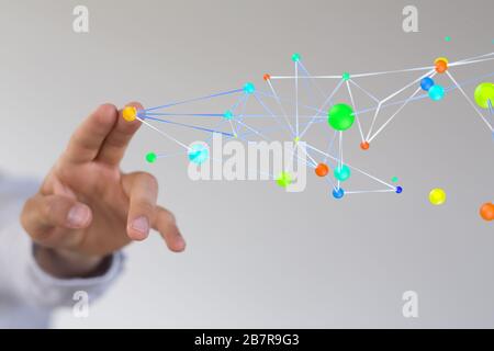 Closeup shot of a person presenting a virtual projection of a colorful digital network Stock Photo