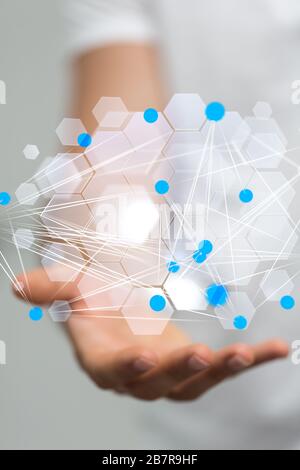 Vertical closeup shot of a businessman presenting the virtual projection of modern data Stock Photo