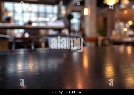 Vintage wooden table and chairs in loft cafe Stock Photo