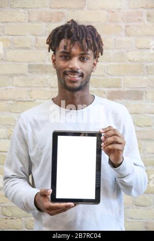 Young Man Holding a Digital Tablet Device. Isolated Screen. Stock Photo