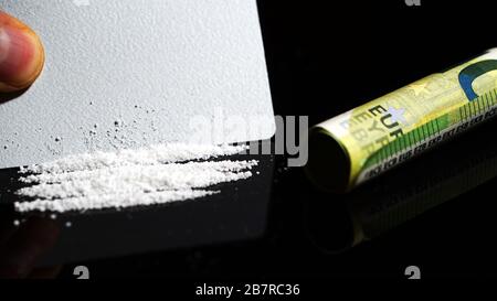 Cocaine lines isolated on black background Stock Photo