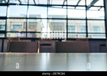 Wooden table and chairs in loft cafe Stock Photo