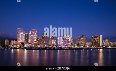 Waikiki beach skyline at dusk Stock Photo