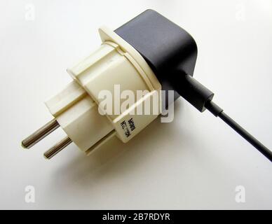 European plug adapter - UK 3 pin plug to European 2 pin plug travel adapter Stock Photo