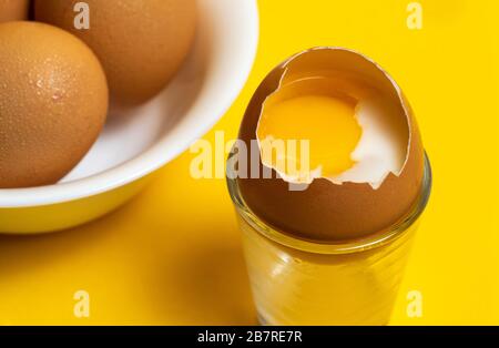 Half cooked egg inside the shell Stock Photo