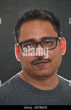 Indian man against dark background Stock Photo