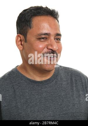 Happy Indian man smiling against a white background Stock Photo - Alamy