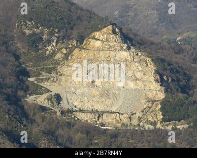 Genoa Italy March 14, 2020:  stone (dolomites, dolomitic limestones) quarry on the side of a mountain (monte Gazzo)