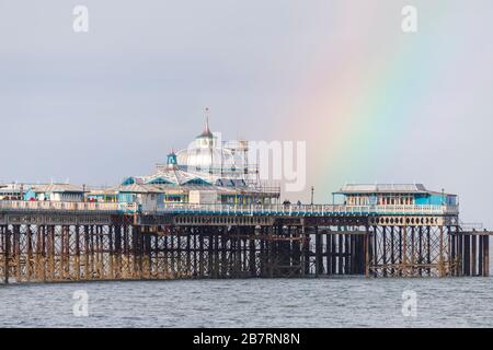 Rainbow over Llandudno Pier on the North Wales coast Stock Photo