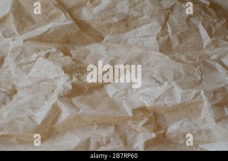 Crumpled tracing paper close-up. The texture of the paper. The basis for a variety of design tasks. Full frame. Selective focus. Stock Photo