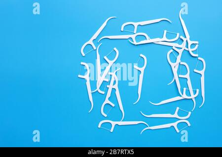 White toothpicks on blue background. Copy space Stock Photo