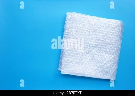 Bubble wrap on blue background. Copy space Stock Photo