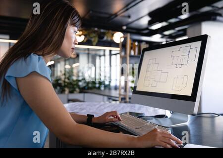 Asian architect woman working on computer Stock Photo