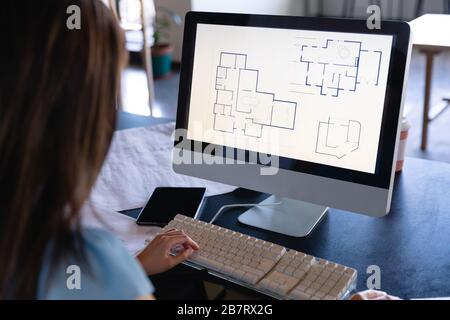 Asian architect woman working on computer Stock Photo