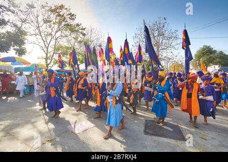 Nihang Singhs march from one Gurudwara to another celebrating the festival of Hola Mohalla in Anandpur Sahib, Punjab, India Stock Photo