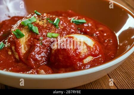 Doro Wat, stew or curry that may be prepared with chicken, beef,  Ethiopian cuisine, Traditional assorted African dishes, Top view. Stock Photo