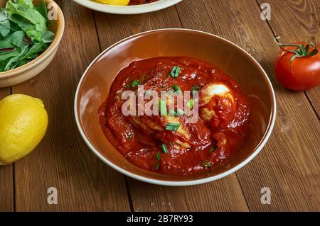 Doro Wat, stew or curry that may be prepared with chicken, beef,  Ethiopian cuisine, Traditional assorted African dishes, Top view. Stock Photo