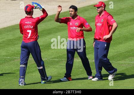 Ravi Bopara of Essex Eagles (C) is congratulated by his team mates after taking the wicket of Chris Cooke Stock Photo