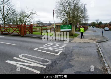 Chippenham, Wiltshire UK, 18th March, 2020. The entrance to Hardenhuish secondary school is pictured this morning as two large secondary schools in Chippenham, Wiltshire were closed to pupils.Hardenhuish and Sheldon schools announced on Tuesday that they would not open on Wednesday because of the coronavirus outbreak.Following the government’s recent advice regarding people self-isolating and social distancing to delay the spread of the Coronavirus both schools had been left with significant staff shortages and said they would remain shut until further notice. Credit: Lynchpics/Alamy Live News Stock Photo
