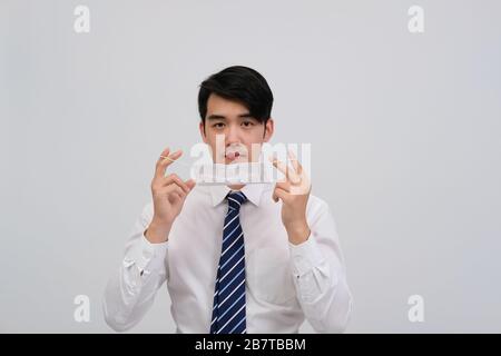 businessman man wearing protective mask against cold flu covid 19 virus bacteria infection pollution Stock Photo