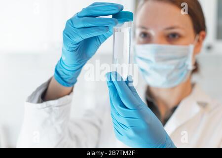 Female Scientist Medical Research Lab researching test tubes in laboratory