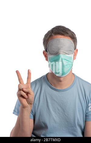 Caucasian man wearing a protection mask and making vistory sign with protective gloves on a white background Stock Photo