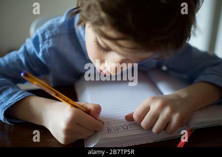 Child being homeschooled during the Coronavirus pandemic Stock Photo
