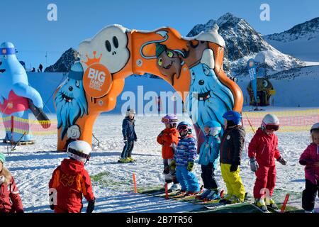 Stubai, Austria - December 20, 2015: Unidentified children on ski school meeting place enjoy winter sports area in Austrian Alps Stock Photo