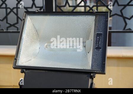 Dubai UAE - November 2019: Close up outdoor LED lamp on the yard. Large outdoor light for building coloring. LED flood light, spot light which lights Stock Photo