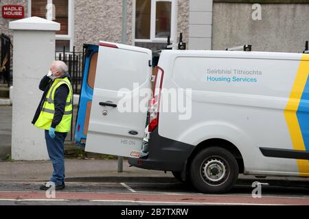 A Dublin City Council worker and housing services van outside a temporary accommodation for the homeless in Dublin. Stock Photo