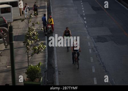 Philippines. 18th Mar, 2020. Commuters on bicycles on their way to work along EDSA in Mandaluyong City on Wednesday, 18 March 2020. Luzon Island is currently under enhanced community quarantine suspending all transportation and works. On Tuesday, 17 March, President Rodrigo Duterte has placed the entire nation under state of calamity in order for the government to respond properly to the rising cases of COVID-19 in the country. (Photo by Larry Monserate Piojo/Sipa USA) Credit: Sipa USA/Alamy Live News Stock Photo