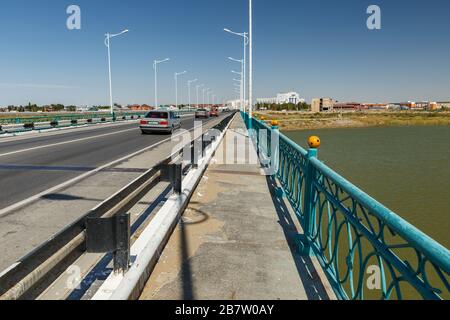 Kyzylorda, Kazakhstan - September 03, 2019: The bridge over the Syr Darya river in the city of Kyzylorda. Stock Photo