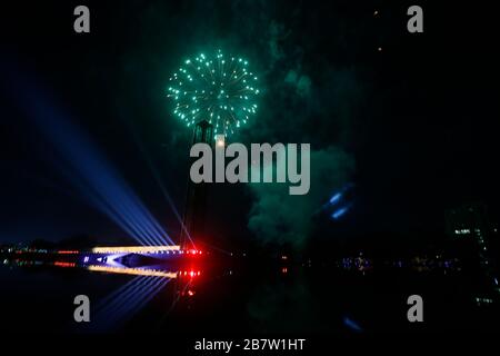 The Swadhinata Stambha at Suhrawardy Udyan is bathed in the glow of fireworks as the nation celebrates the 100th birth anniversary of Father of the Na Stock Photo