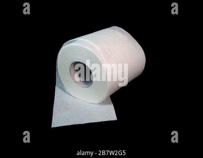 Three toilet paper rolls on a black background Stock Photo