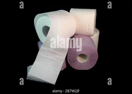 Three toilet paper rolls on a black background Stock Photo