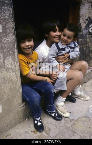 San Cristobal de las Casas, Chiapas, Mexico: Children sitting in doorway. ©Bob Daemmrich Stock Photo