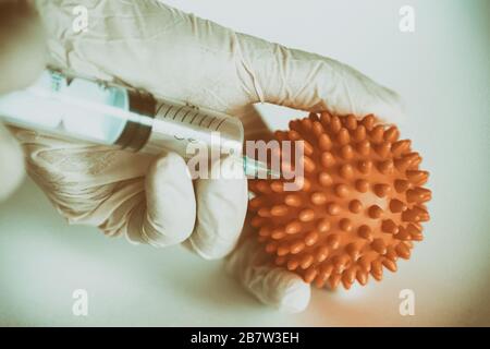 The researcher takes an analysis of abstract virus model. Antiviral research to find a cure or treatment for the covid-19 virus. Working in a biologic Stock Photo