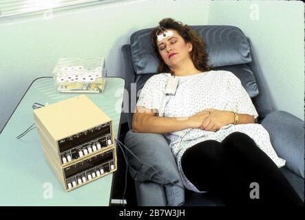 Austin Texas USA: Patient uses biofeedback to train her muscles to relax.  ©Bob Daemmrich Stock Photo