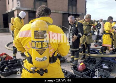 College Station Texas USA:  Industrial firefighters prepare to tackle a simulated house fire at training school. ©Bob Daemmrich Stock Photo