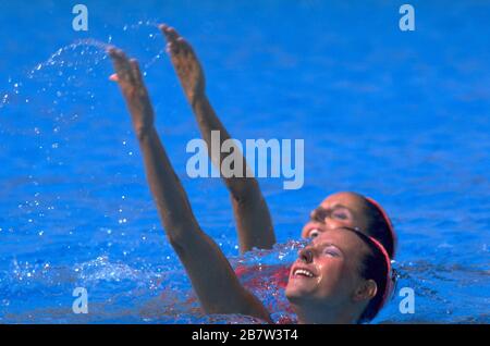 Synchronized swimmers performing in team competition at Summer Olympics.     ©Bob Daemmrich Stock Photo